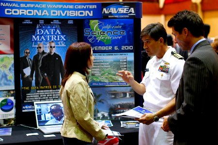 US Navy 101004-N-8863V-198 Capt. Jay Kadowaki, center, commanding officer of Naval Surface Warfare Center, Corona Division, describes civilian U.S