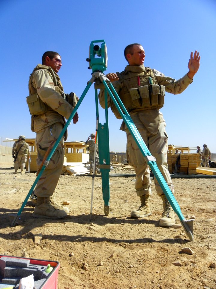 US Navy 101008-N-7743H-154 Builder 2nd Class Nikolas Jaggan and Steel Worker Johnny Mainmast, both assigned to NMCB-40, take a break while surveyi
