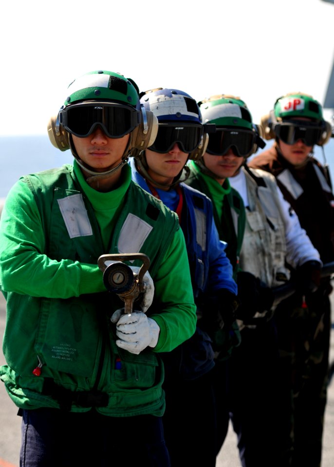 US Navy 101009-N-3374C-091 Sailors man the fire hoses during a mass casualty drill on the flight deck of the aircraft carrier USS George H.W. Bush