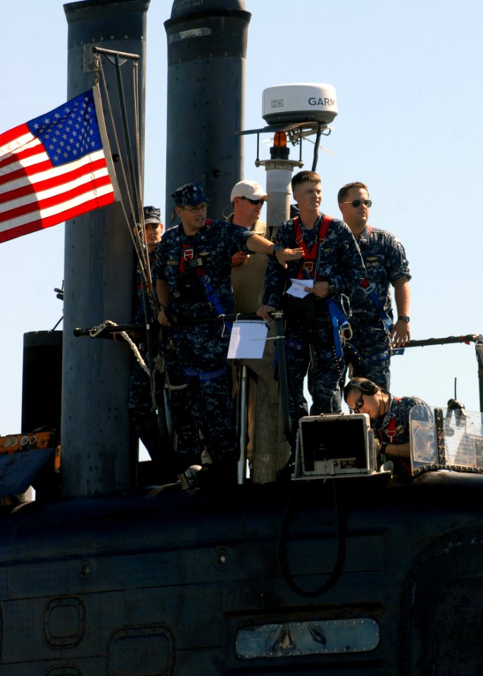 US Navy 101008-N-7705S-058 Cmdr. J. Carl Hartsfield navigates from the bridge as the Los Angeles-class attack submarine USS Newport News (SSN 750)
