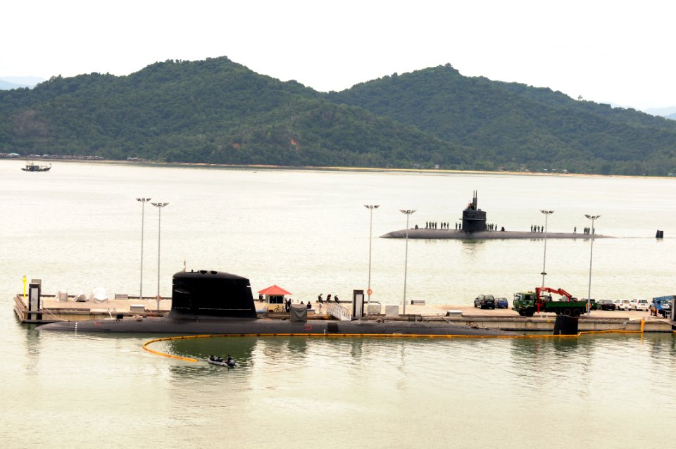 US Navy 101011-O-0000X-010 he Los Angeles-class attack submarine USS Jacksonville (SSN 699) prepares to moor across the pier from Malaysia's first