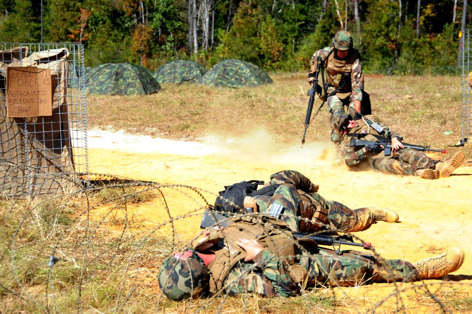 US Navy 101013-N-3013W-247 A Seabee assigned to Naval Mobile Construction Battalion (NMCB) 26, drags his injured shipmate to safety during a simula
