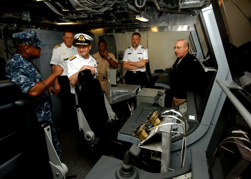 US Navy 101012-N-6125G-018 Cmdr. Michael Riley, left, commanding officer of the littoral combat ship USS Independence (LCS 2),