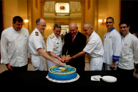 US Navy 101013-N-6736S-077 Georgia Gov. Sonny Perdues cut the Navy's 235th Birthday cake after the Atlanta Navy Week Proclamation ceremony photo