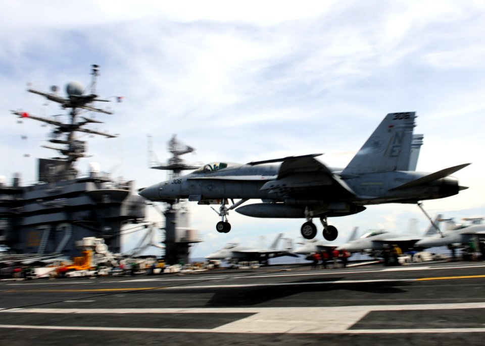 US Navy 101006-N-4973M-047 A F-A-18C Hornet assigned to the Vigilantes of Strike Fighter Squadron (VFA) 151 lands on the flight deck of the aircraf