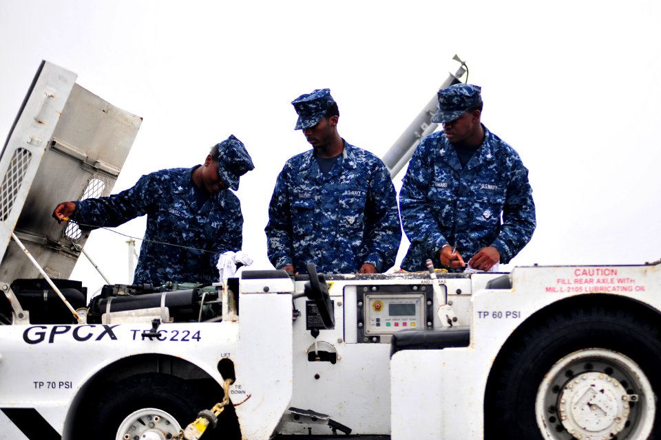 US Navy 101013-N-2953W-551 Sailors conduct pre-operational and functional checks on a tractor aboard the aircraft carrier USS Carl Vinson (CVN 70)
