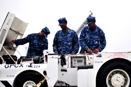 US Navy 101013-N-2953W-551 Sailors conduct pre-operational and functional checks on a tractor aboard the aircraft carrier USS Carl Vinson (CVN 70)