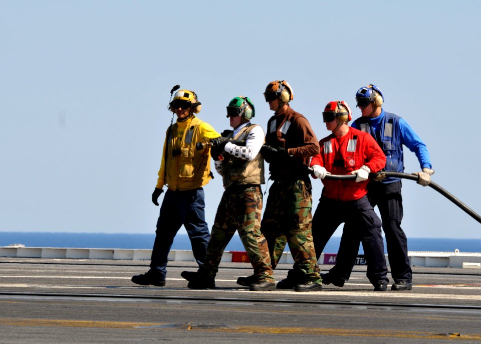 US Navy 101009-N-3374C-071 Sailors prepare to extinguish a fire during a mass casualty drill on the flight deck of the aircraft carrier USS George