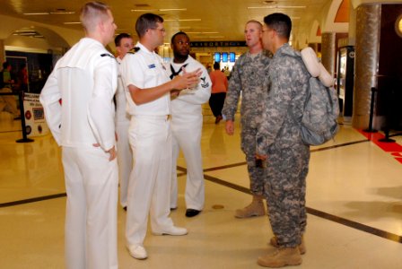 US Navy 101012-N-6736S-007 Sailors from the guided-missile submarine USS Georgia (SSGN 729) greet fellow service members at Hartsfield-Jackson Atla photo