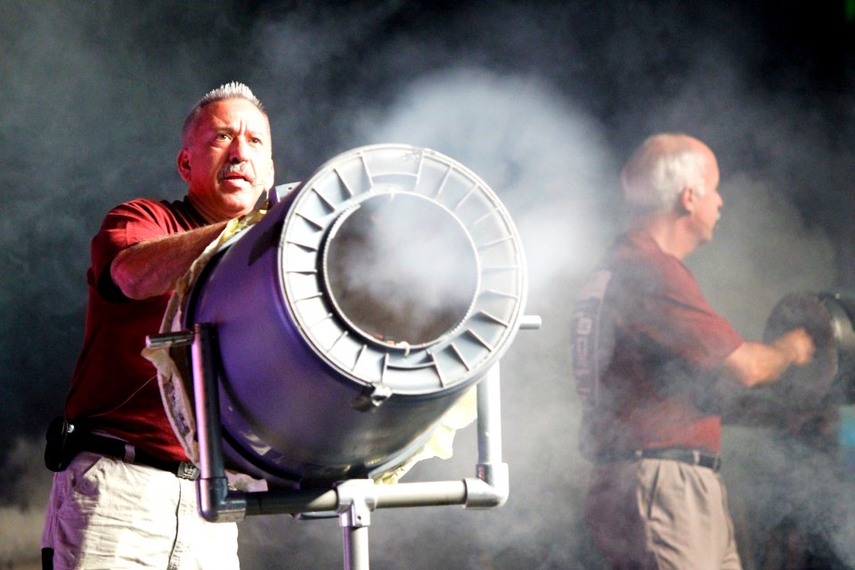 US Navy 101013-N-8863V-211 General Atomics technician Rigo Brambila, left, and scientist Rick Lee fire smoke rings at the audience during the 11th