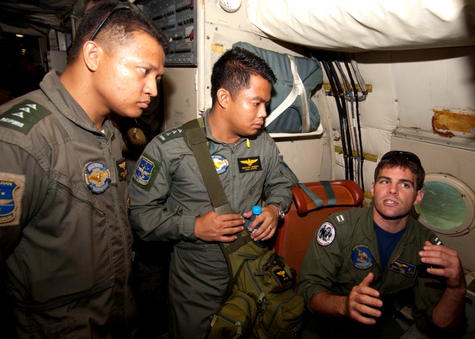 US Navy 101013-N-6770T-235 t. Sean O'Neill, a pilot assigned to Patrol Squadron Nine (VP) 9, explains maritime patrol procedures aboard a P-3C Orio