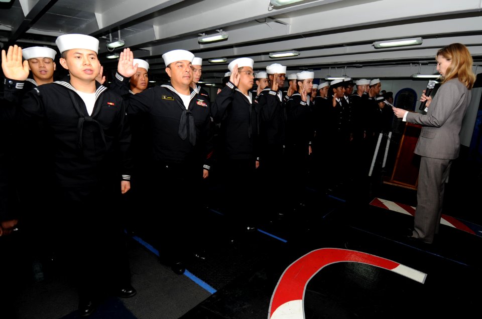 US Navy 101009-N-7191M-072 Sailors take the oath of allegiance during a naturalization ceremony in the foc'sle aboard the aircraft carrier USS Geor