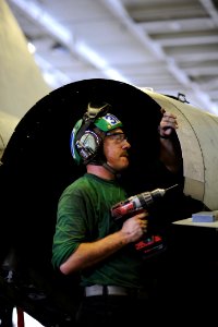 US Navy 101008-N-3793B-039 Aviation Structural Mechanic 3rd Class Joseph Morton, from Kansas City, Kan., assigned to the Ragin' Bulls of Strike Fig