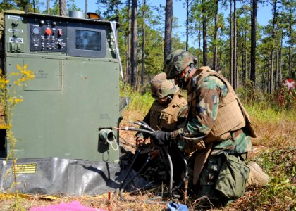 US Navy 101014-N-9564W-023 Hospital Corpsman hard-wire a generator during a battalion field training exercise photo