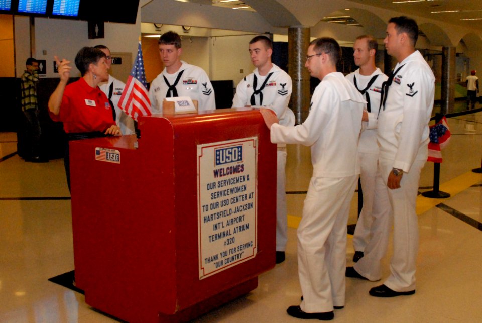 US Navy 101012-N-6736S-006 USO volunteer Pat Horvath instructs Sailors from the guided-missile submarine USS Georgia (SSGN 729) on how to greet ret