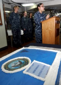 US Navy 101013-N-2013O-061 Interior Communications Electrician 3rd Class Marciel Caba, from Bronx, N.Y., speaks to Sailors on the mess decks during