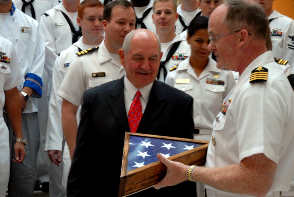 US Navy 101013-N-6736S-055 Georgia Gov. Sonny Perdue, left, is presented a flag that was flown over the Ohio-class guided-missile submarine USS Geo