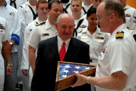 US Navy 101013-N-6736S-055 Georgia Gov. Sonny Perdue, left, is presented a flag that was flown over the Ohio-class guided-missile submarine USS Geo
