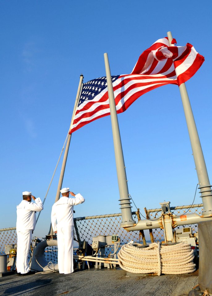 US Navy 101012-N-5292M-784 Sailors conduct morning colors aboard the guided-missile destroyer USS Cole (DDG 67)