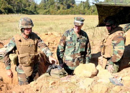 US Navy 101013-N-3013W-193 Utiltiesman 2nd Class Vincent Karkau, assigned to Navy Mobile Construction Battalion (NMCB) 26, demonstrates his field c