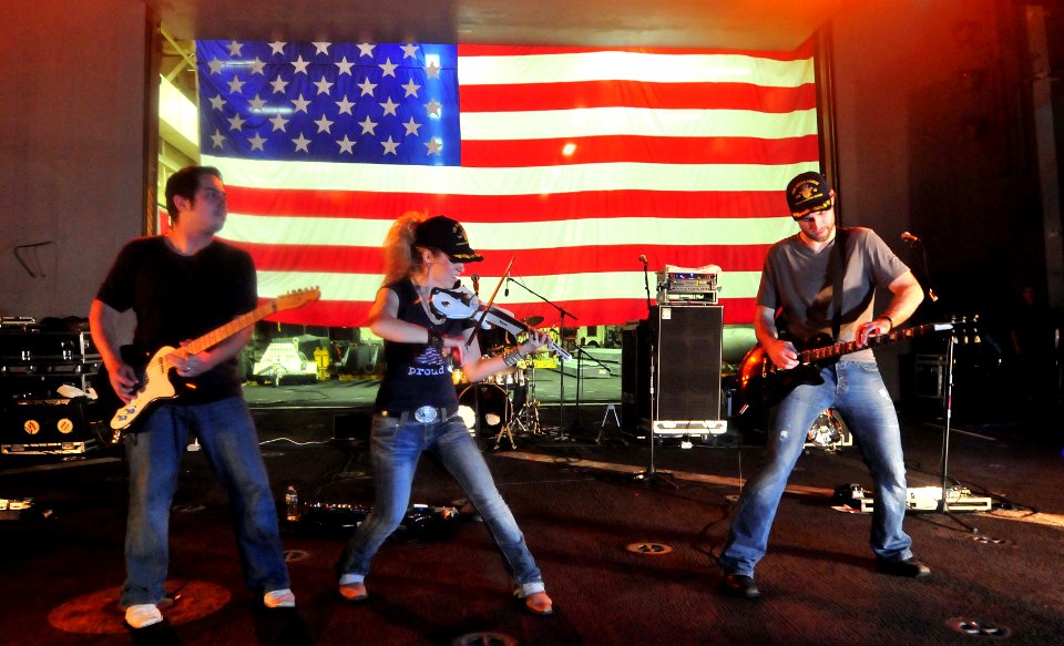 US Navy 111129-N-CT127-526 Natalie Stovall, a country music artist, and her band perform during a Navy Entertainment-sponsored concert aboard the S