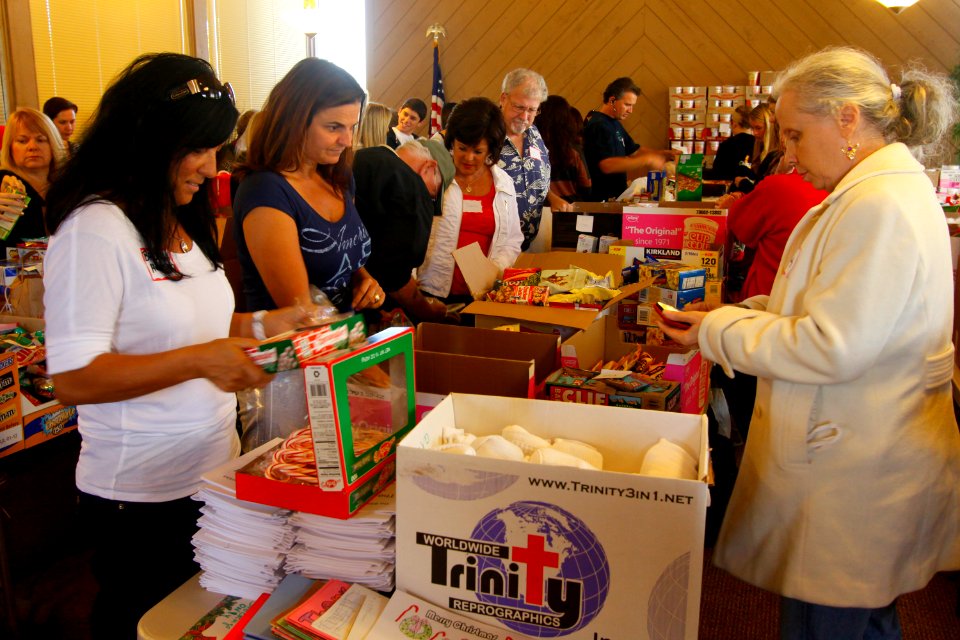 US Navy 111126-N-RC734-007 Volunteers stuff stockings and fill care packages for Sailors and marines deployed overseas as part of an outreach suppo