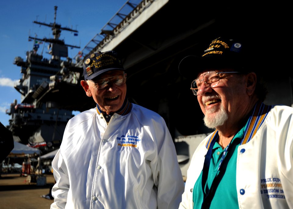 US Navy 111127-N-NY820-032 Plankowners Felix Summers, right, and Jim Keethler discuss their time aboard the aircraft carrier USS Enterprise (CVN 65