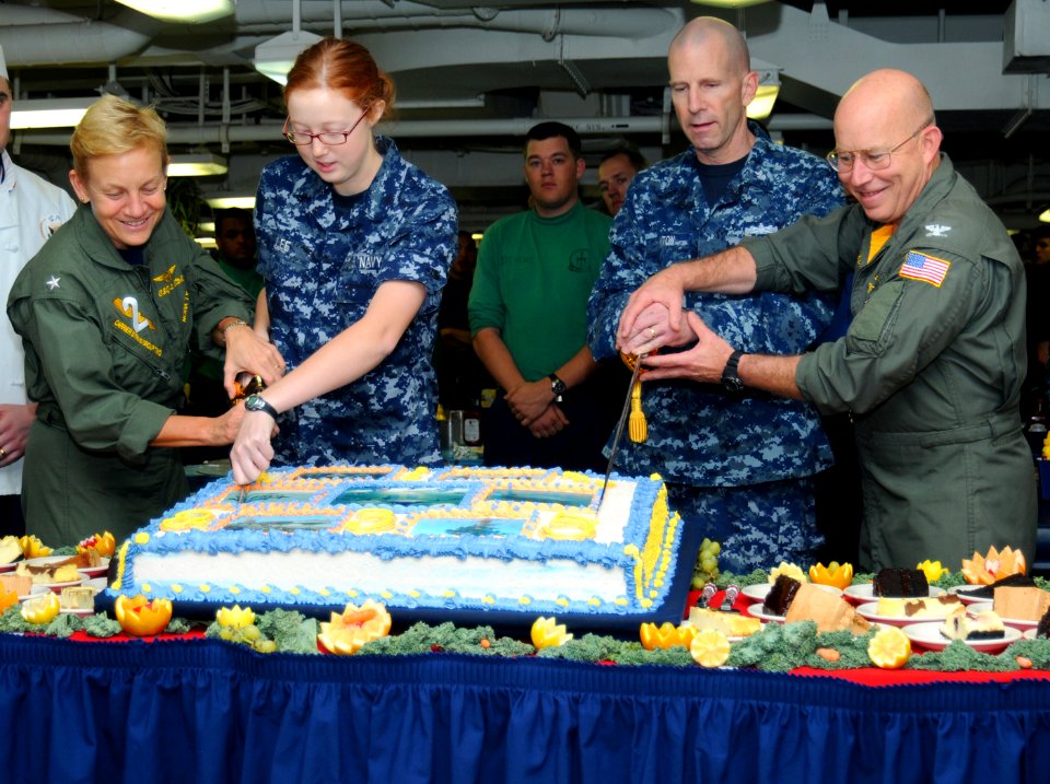 US Navy 101013-N-6632S-040 Sailors cut a cake in celebration of the Navy's 235th birthday