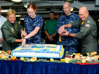 US Navy 101013-N-6632S-040 Sailors cut a cake in celebration of the Navy's 235th birthday