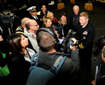 US Navy 111125-N-TB177-065 Capt. Brian Luther, commanding officer of the aircraft carrier USS George H.W. Bush (CVN 77), gives an interview to news