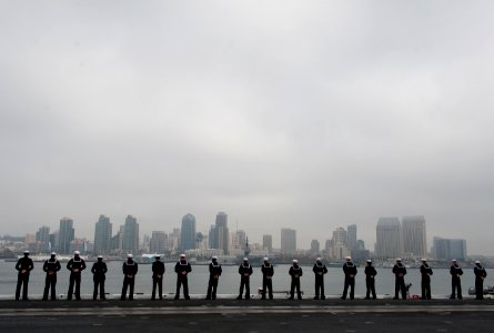 US Navy 111130-N-DR144-982 Sailors man the rails as Nimitz-class aircraft carrier USS Carl Vinson (CVN 70) departs Naval Air Station North Island f