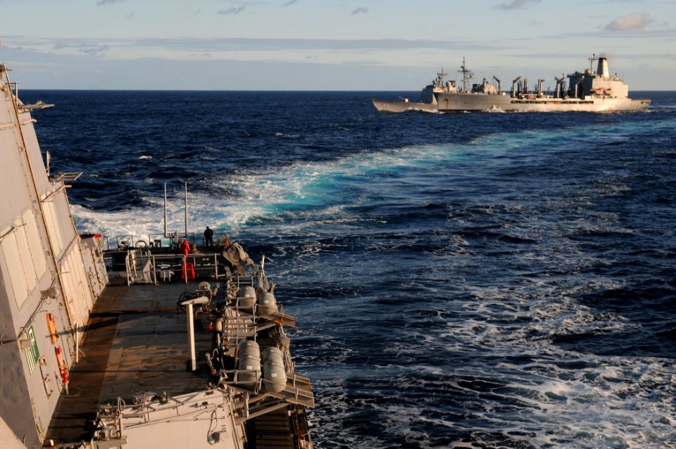 US Navy 111130-N-XQ375-310 he guided-missile destroyer USS Mitscher (DDG 57) breaks away from the guided-missile cruiser USS Anzio (CG 68) and the