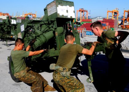 US Navy 111128-N-WJ771-047 Marines move a water pump assembly into position photo
