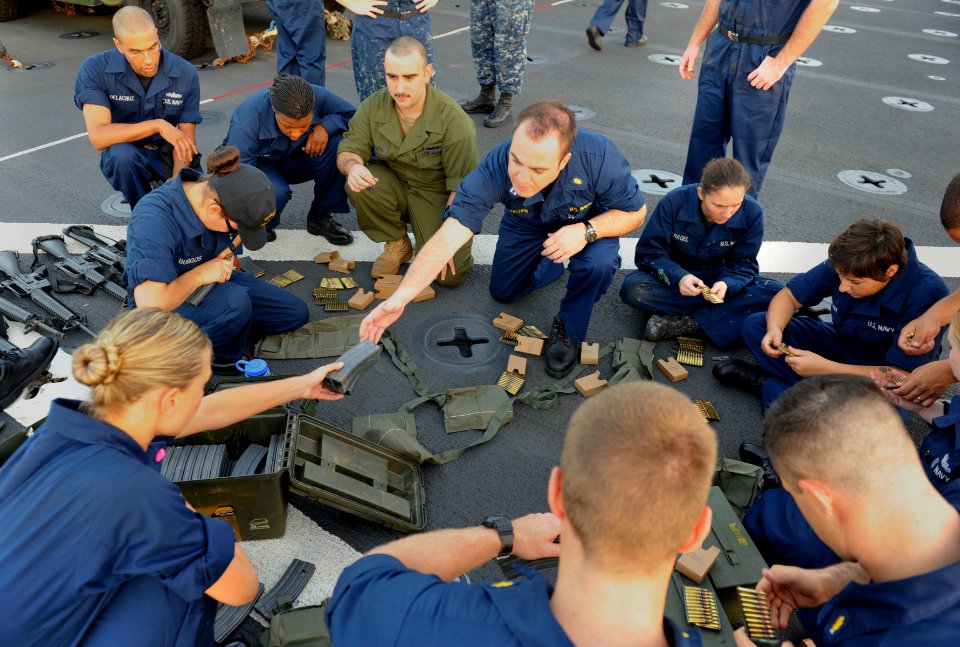 US Navy 111129-N-KS651-037 Sailors load magazines prior to a live fire exercise