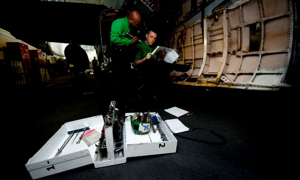 US Navy 111127-N-OY799-007 Aviation Electrician's Mate 1st Class Selvarajah Srisaba and Aviation Structural Mechanic (Equipment) 1st Class Anthony