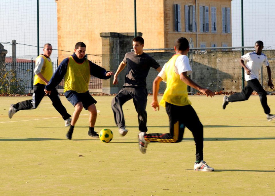 US Navy 111128-N-YC505-544 Sailors from the aircraft carrier USS George H.W. Bush (CVN 77) play soccer with students from the Ecole de la Deuxime C
