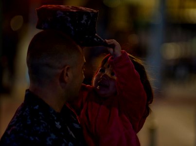 US Navy 111130-N-DR144-161 Damage Controlman 1st Class Doyle Ebarb says goodbye to his daughter before the Nimitz-class aircraft carrier USS Carl V
