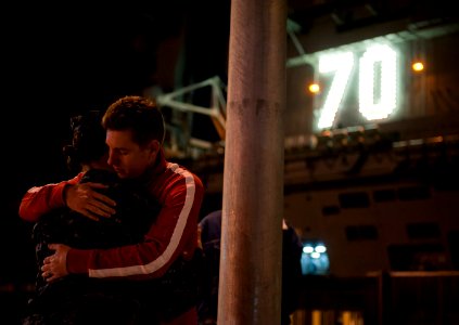 US Navy 111130-N-DR144-140 A Sailor says goodbye to her family before the Nimitz-class aircraft carrier USS Carl Vinson (CVN 70) departs Naval Air