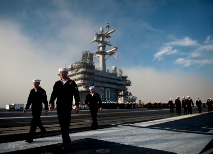 US Navy 111130-N-DR144-349 Sailors man the rails as the Nimitz-class aircraft carrier USS Carl Vinson (CVN 70) prepares to depart Naval Air Station