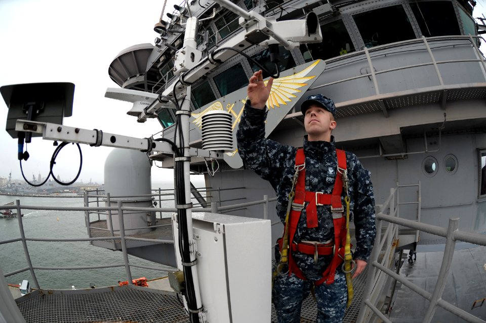 US Navy 111129-N-PO203-114 A Sailor checks an automated shipboard weather observation system