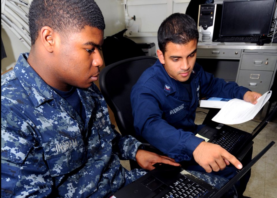 US Navy 111202-N-YC505-090 Sailors review software aboard ship