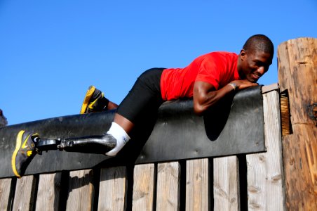 US Navy 111202-N-JR159-035 A wounded service member from Naval Medical Center San Diego participates in the obstacle course at the Naval Special Wa photo