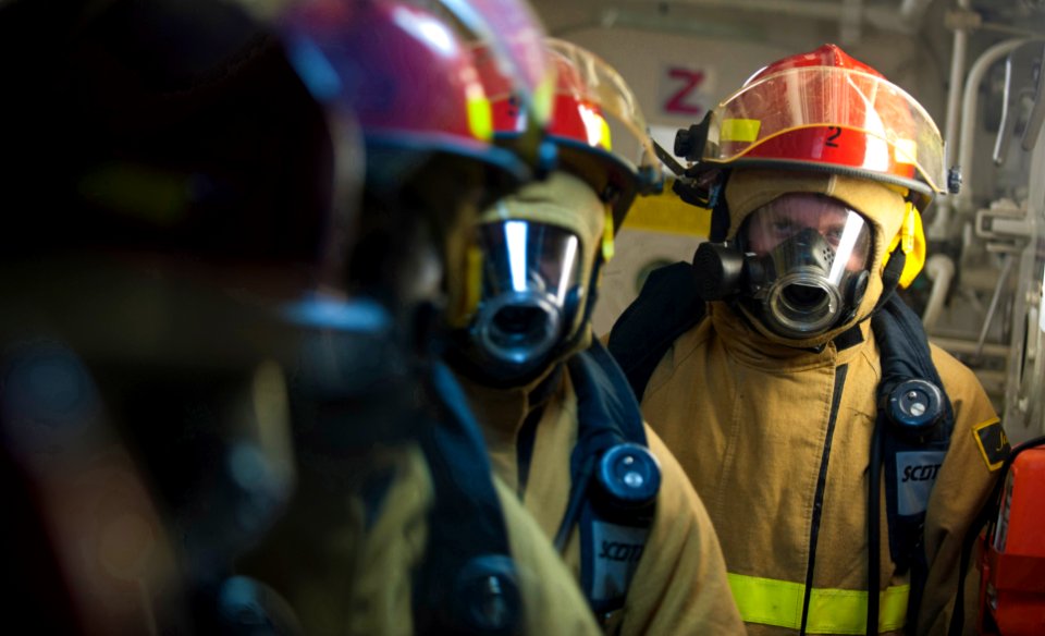 US Navy 111201-N-PB383-508 Sailors prepare to enter a main space during a damage control exercise aboard the amphibious transport dock ship USS New