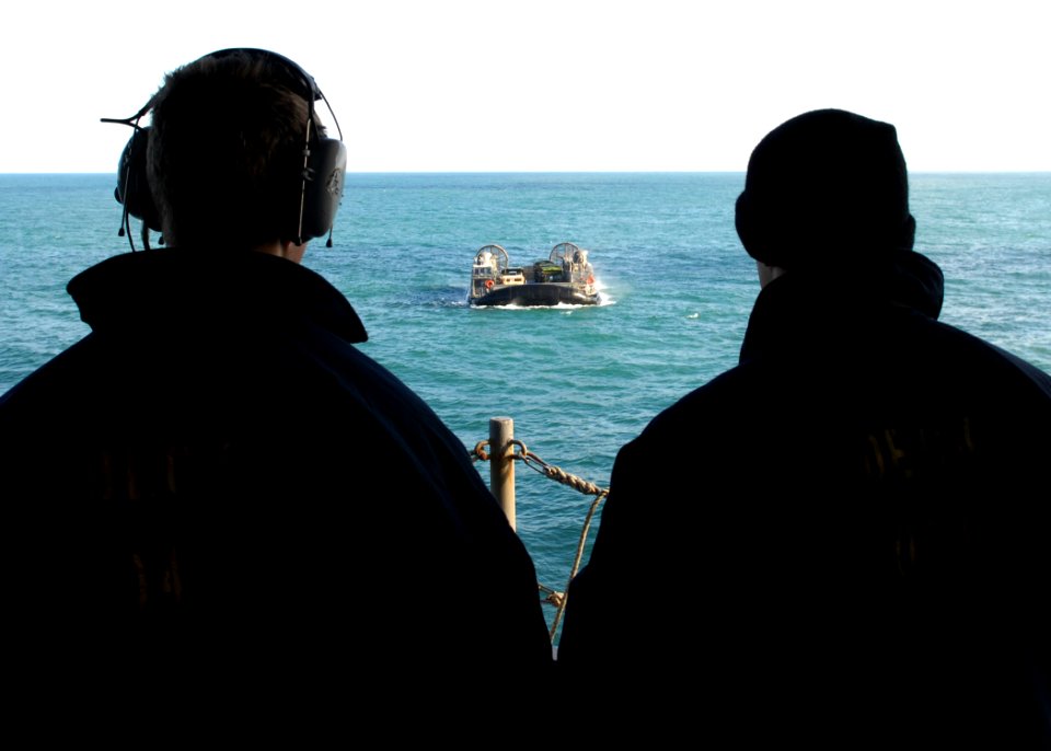 US Navy 111130-N-VE788-049 Sailors aboard the multi-purpose amphibious assault ship USS Iwo Jima (LHD 7) stand lookout watch as a landing craft air