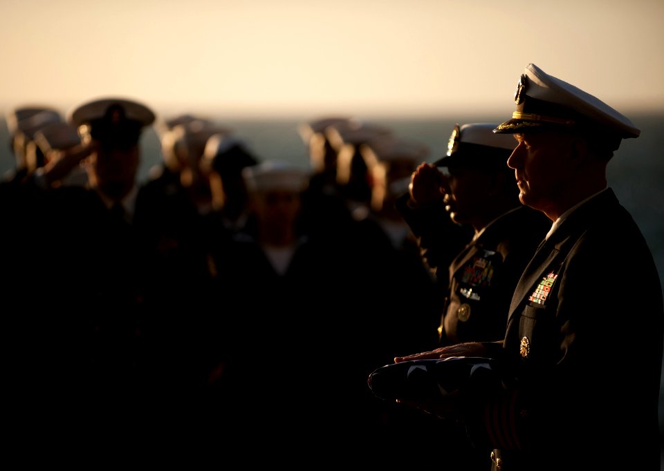 US Navy 111201-N-DR144-542 Capt. Bruce H. Lindsey, commanding officer of the Nimitz-class aircraft carrier USS Carl Vinson (CVN 70), holds the fold