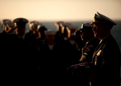US Navy 111201-N-DR144-542 Capt. Bruce H. Lindsey, commanding officer of the Nimitz-class aircraft carrier USS Carl Vinson (CVN 70), holds the fold