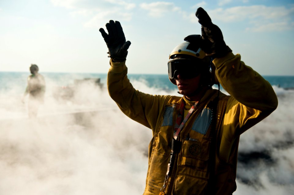 US Navy 111130-N-BT887-093 A Sailor directs aircraft