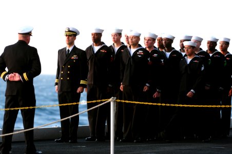 US Navy 111201-N-RG587-001 Sailors form ranks in preparation for a burial at sea ceremony for 20 former service members aboard the Nimitz-class air