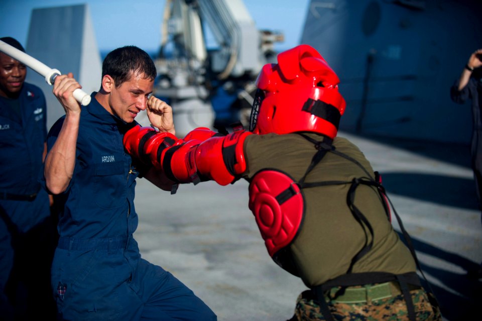 US Navy 111203-N-PB383-746 Hull Technician Fireman Nicholas Ardoin defends against a simulated attacker after being sprayed with Oleoresin Capsicum