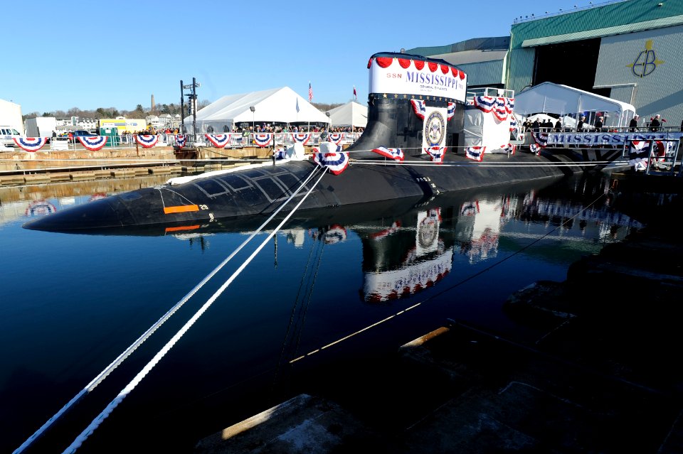 US Navy 111203-N-UM744-004 Sailors assigned to the Virginia-class attack submarine Pre-Commissioning Unit (PCU) Mississippi (SSN 782) file off the